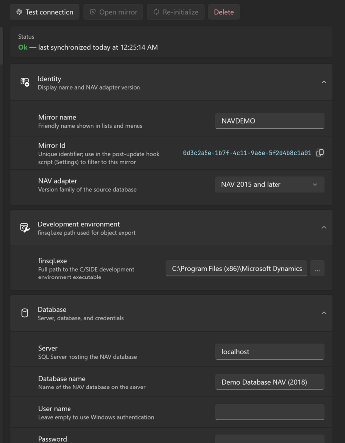 The details of a selected mirror: the command bar, the Status card and the Identity and Development environment groups